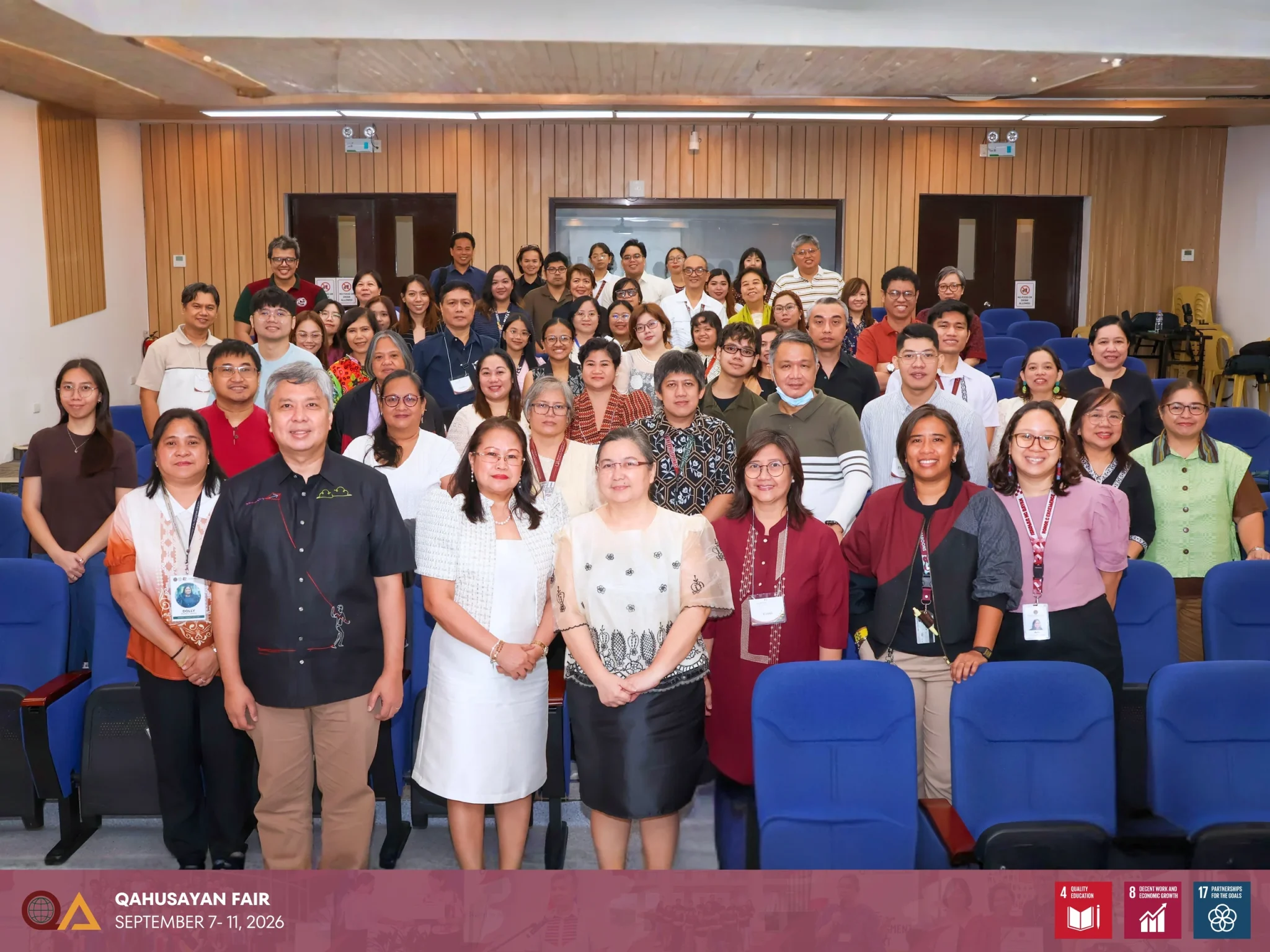 UPD Chancellor Edgardo Carlo L. Vistan II, School of Urban and Regional Planning Dean Dina C. Magnaye, and UPD QAO Director Evangeline C. Amor posed for a photo with the attendees of the QAhusayan Fair opening ceremony at Pilar Herrera Hall, College of Social Sciences and Philosophy.