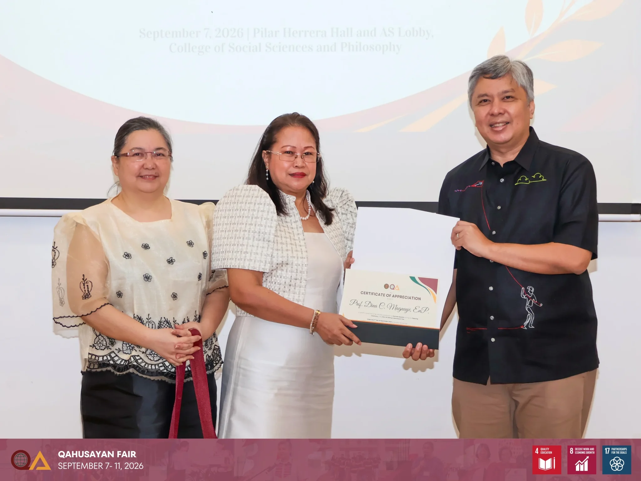 UPD QAO Director Evangeline C. Amor and UP Diliman Chancellor Edgardo Carlo L. Vistan II presented the Certificate of Appreciation to School of Urban and Regional Planning Dean Dina C. Magnaye for her keynote address during the opening ceremony of the QAhusayan Fair.